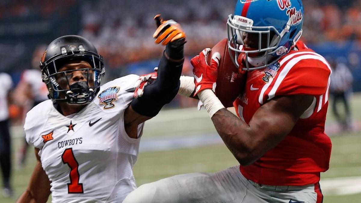 Mississippi wide receiver Laquon Treadwell (1) pulls in a touchdown reception in front of Oklahoma State cornerback Kevin Peterson (1) in the first half of the Sugar Bowl college football game in New Orleans, Friday, Jan. 1, 2016.