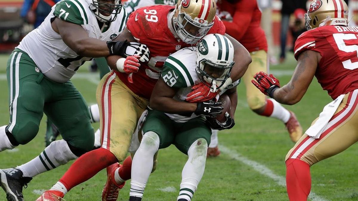 New York Jets running back Bilal Powell (29) is tackled by San Francisco 49ers defensive end DeForest Buckner (99) during the second half of an NFL football game in Santa Clara, Calif., Sunday, Dec. 11, 2016.