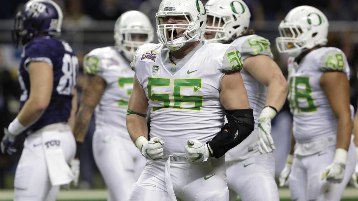 Oregon defensive lineman Alex Balducci (56) celebrates a play during the second half of the Alamo Bowl NCAA college football game against TCU , Saturday, Jan. 2, 2016, in San Antonio. TCU won in triple overtime 47-41.