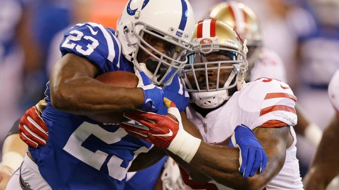 NaVorro Bowman, right, tackles former 49ers teammate Frank Gore, now with the Indianapolis Colts, on Sunday in Indianapolis. Bowman led the 49ers with 10 tackles but also spent a lot of time on the sideline.