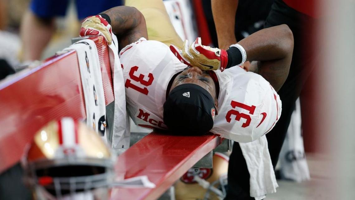 San Francisco 49ers defensive back L.J. McCray (31) is attended to on the bench during the second half of an NFL football game agains the Arizona Cardinals, Sunday, Sept. 27, 2015, in Glendale, Ariz.