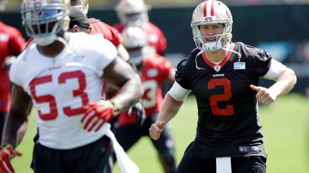 San Francisco 49ers linebacker NaVorro Bowman (53) and quarterback Blaine Gabbert (2) warm up during an NFL football practice Thursday, June 9, 2016, in Santa Clara, Calif. The 49ers open camp Sunday, July 31, in Santa Clara.