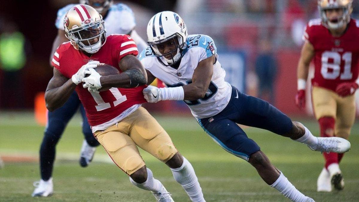 San Francisco 49ers’ Marquise Goodwin (11) runs 14 yards and tackled by Tennessee Titans Adoree' Jackson in the fourth quarter during a game at Levi's Stadium in Santa Clara, Calif. on Sunday December 17, 2017.