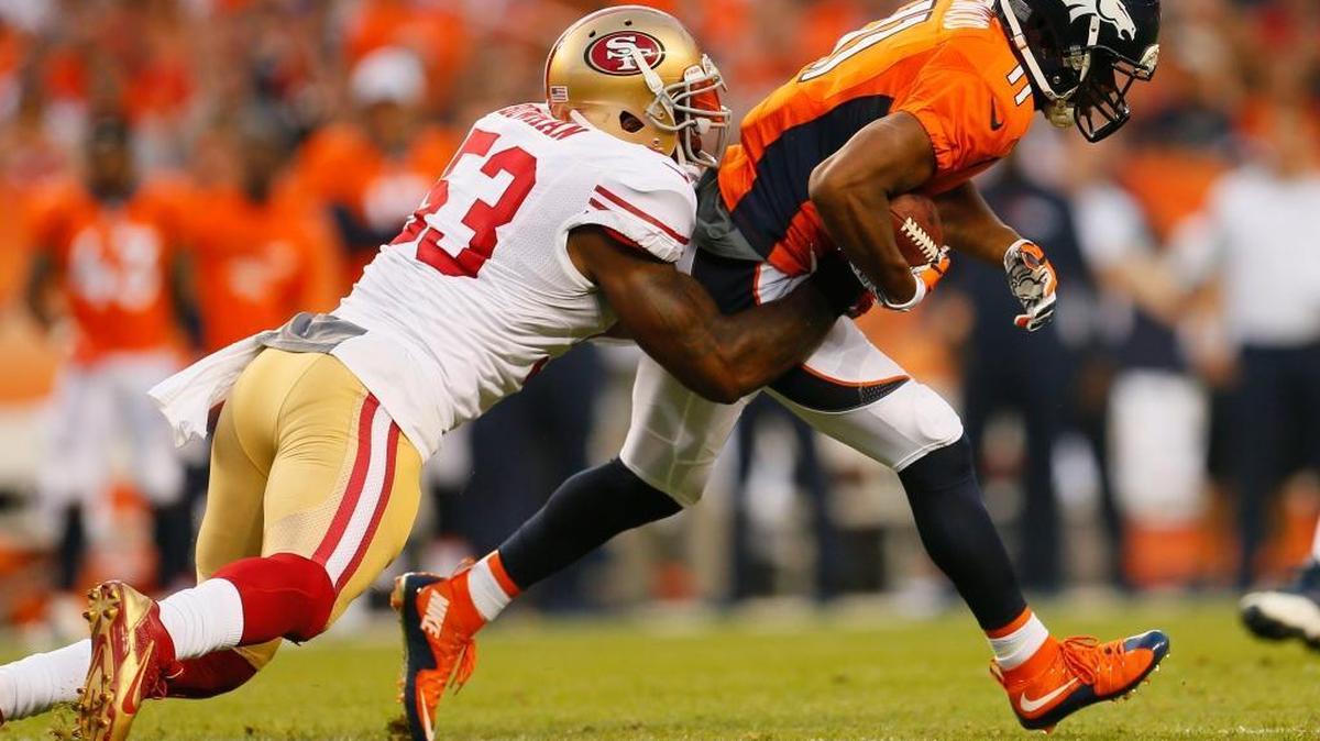 
San Francisco 49ers inside linebacker NaVorro Bowman (53) tackles Denver Broncos wide receiver Jordan Norwood (11) during the first half of an NFL preseason football game, Saturday, Aug. 29, 2015, in Denver.
