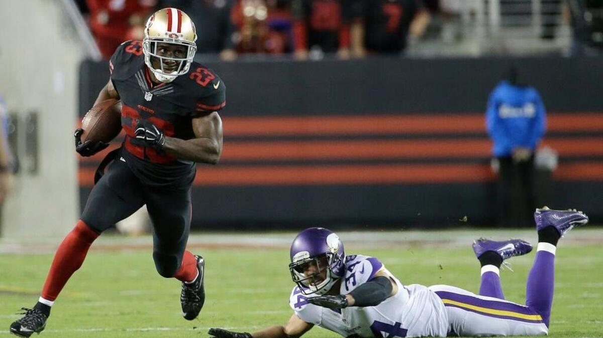 
49ers running back Reggie Bush (23) runs past Minnesota strong safety Andrew Sendejo during the first half of Monday night’s game at Levi’s Stadium in Santa Clara. 

