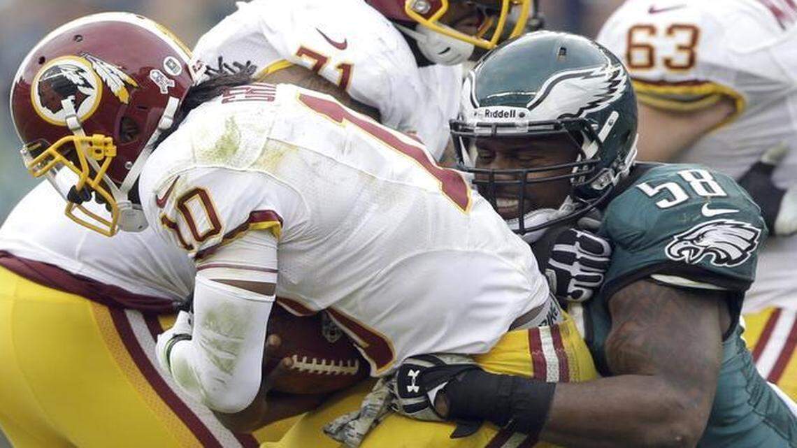 
Trent Cole (58), sacking Washington Redskins quarterback Robert Griffin III while Cole was playing for the Philadelphia Eagles, has drawn interest from the San Francisco 49ers as well as from the Seattle Seahawks
