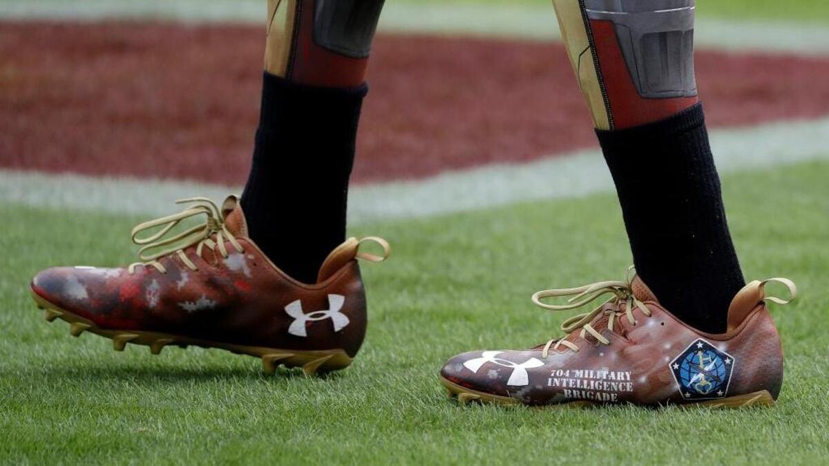 The cleats of 49ers wide receiver Torrey Smith are shown as he warms up before an NFL football game against the New England Patriots in Santa Clara on Sunday, Nov. 20, 2016.