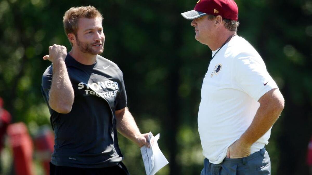 Washington Redskins offensive coordinator Sean McVay, left, talks with head coach Jay Gruden during practice at the team's NFL football training facility at Redskins Park, Wednesday, June 8, 2016 in Ashburn, Va.