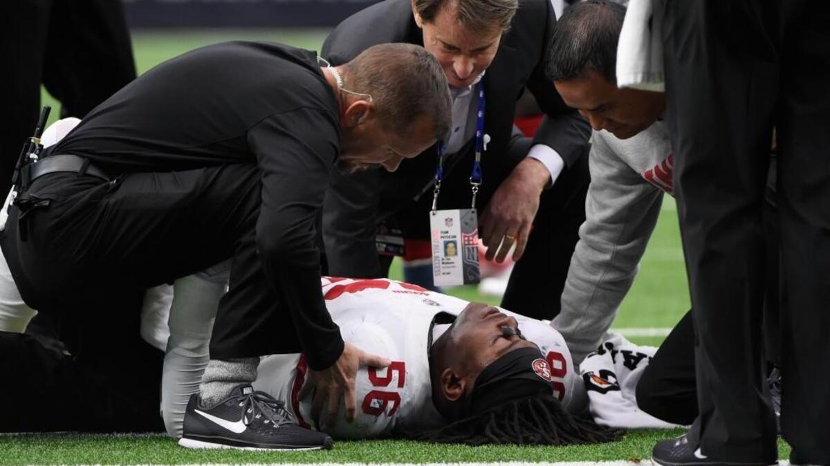 San Francisco 49ers outside linebacker Reuben Foster (56) is helps on the field after an injury during the first half of an NFL football game against the Houston Texans, Sunday, Dec. 10, 2017, in Houston.