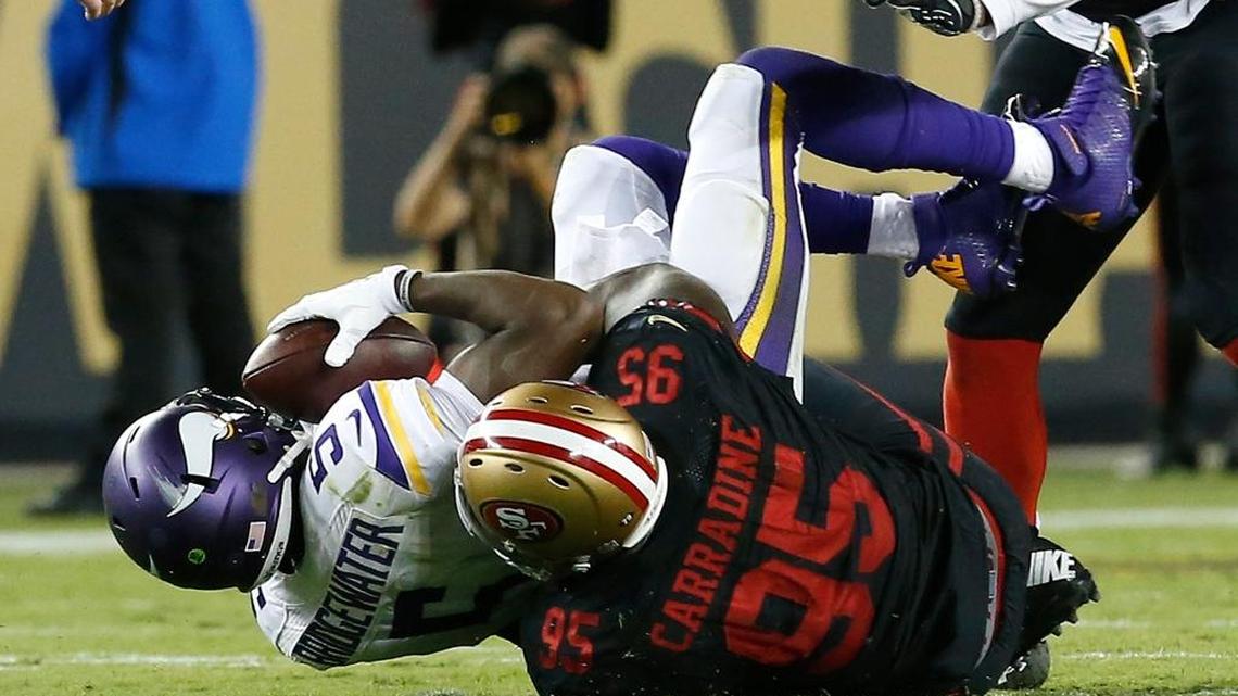 San Francisco 49ers defensive end Tank Carradine (95) sacks Minnesota Vikings quarterback Teddy Bridgewater during the first half of an NFL football game in Santa Clara, Calif., Monday, Sept. 14, 2015.