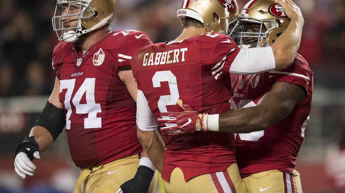 San Francisco 49ers' Carlos Hyde (28) celebrates with San Francisco 49ers starting quarterback Blaine Gabbert (2) and San Francisco 49ers' Joe Staley (74) after touchdown in the fourth quarter against the Los Angeles Rams during a game at Levi's Stadium on Monday September 12, 2016 in Santa Clara, Calif.