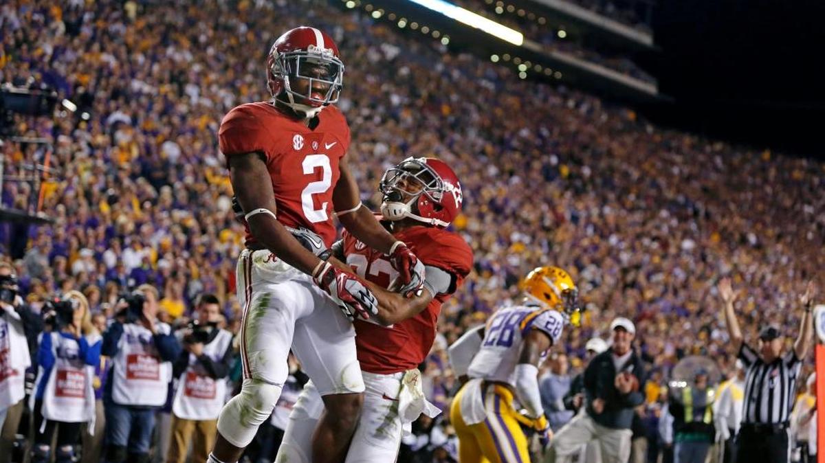 
Alabama wide receiver DeAndrew White (2) celebrates his game winning touchdown with wide receiver Christion Jones (22) in the second half of an NCAA college football game against LSU in Baton Rouge, La., Saturday, Nov. 8, 2014. Alabama won in overtime 20-13. 
