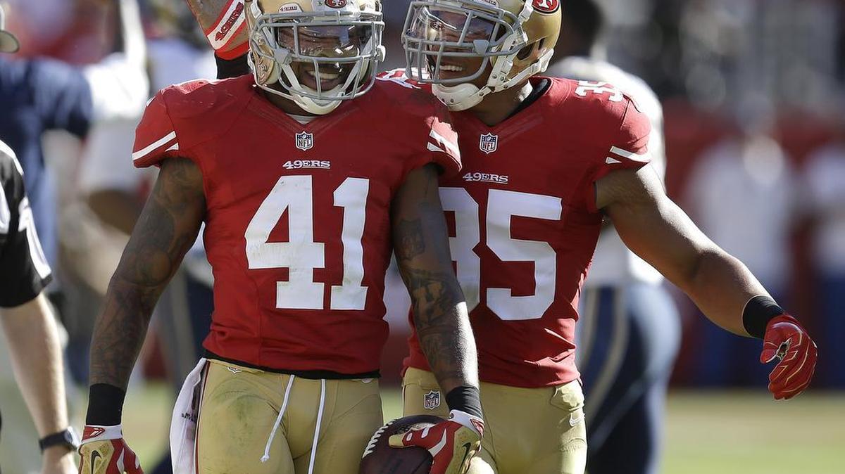 
San Francisco 49ers strong safety Antoine Bethea (41) is congratulated by safety Eric Reid after intercepting a pass by St. Louis Rams quarterback Austin Davis during the second quarter of an NFL football game in Santa Clara, Calif., Sunday, Nov. 2, 2014. 
