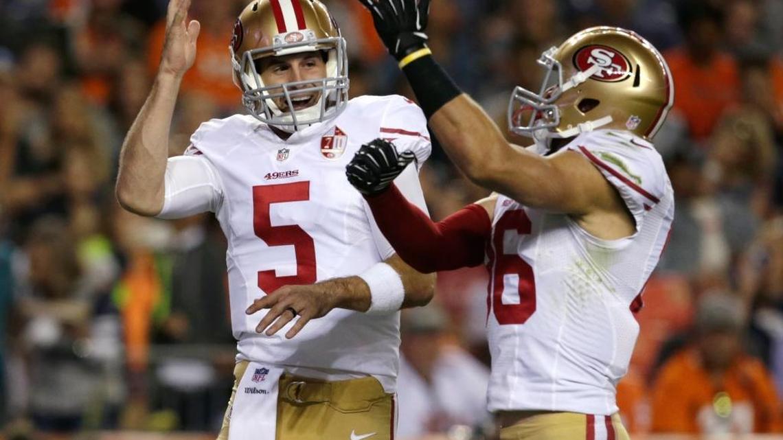 San Francisco 49ers quarterback Christian Ponder, left, celebrates with wide receiver Devon Cajuste after Ponder ran for a touchdown during the second half of a preseason NFL football game against the Denver Broncos, Saturday, Aug. 20, 2016, in Denver.