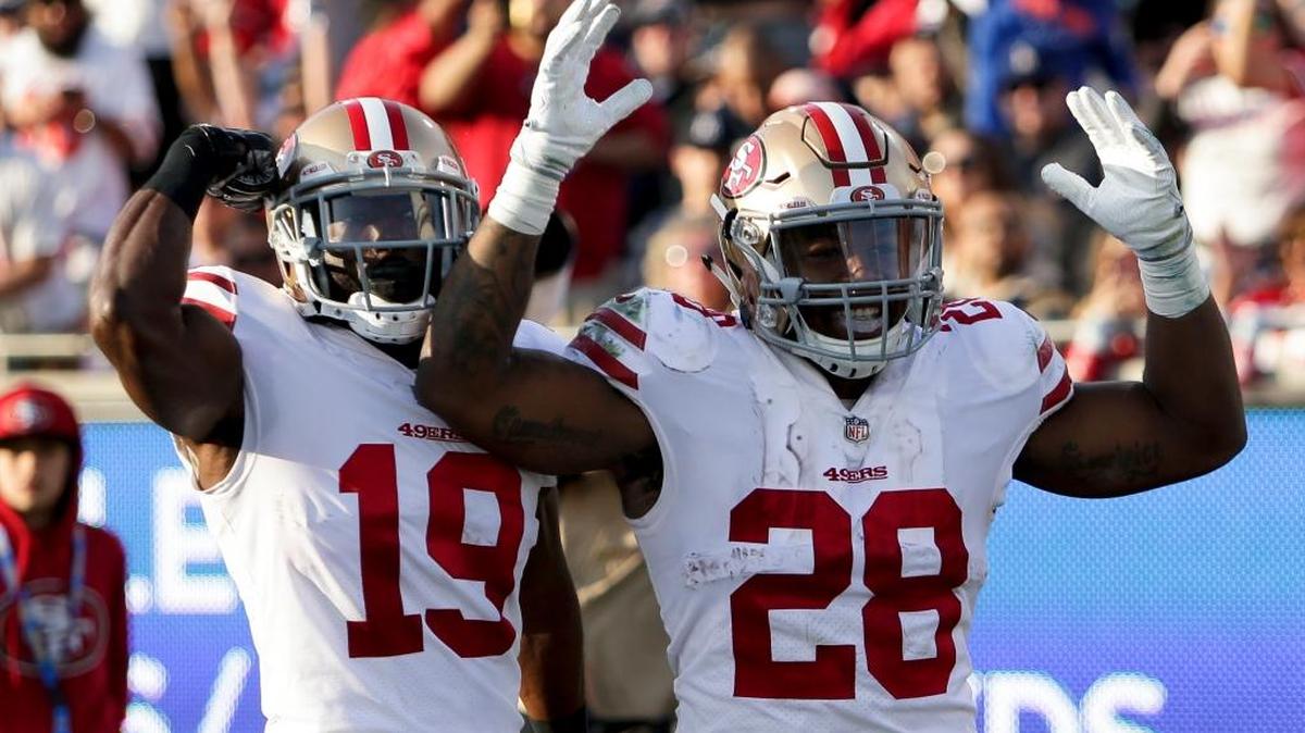 San Francisco 49ers running back Carlos Hyde, right, celebrates after scoring against the Los Angeles Rams during the first half of an NFL football game Sunday, Dec. 31, 2017, in Los Angeles.