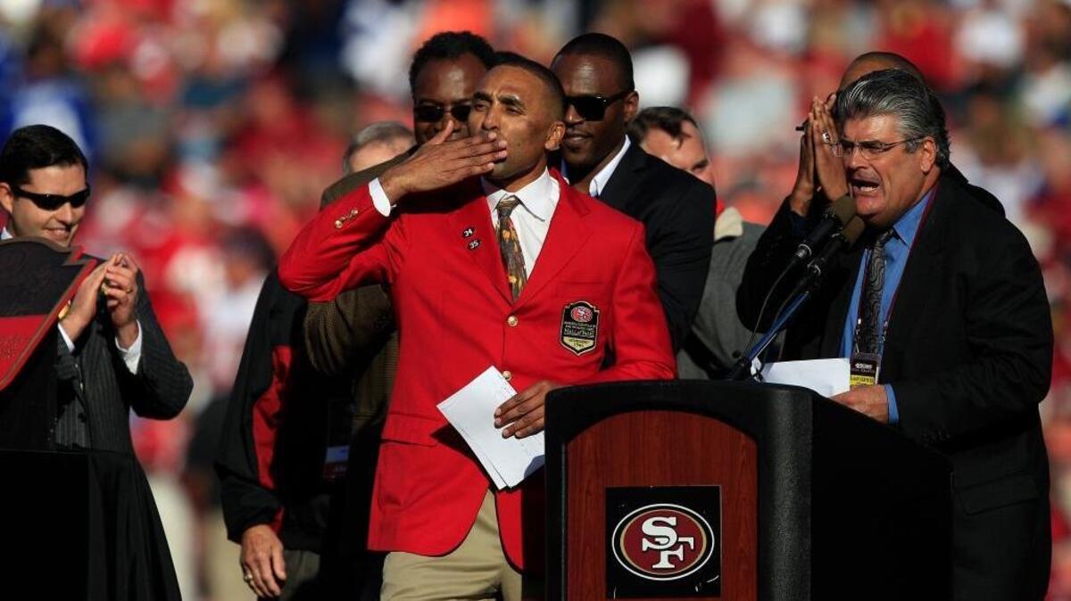 Former San Francisco 49ers running back Roger Craig blows a kiss during a halftime ceremony of an NFL football game between the San Francisco 49ers and the New York Giants in San Francisco, Sunday, Nov. 13, 2011.