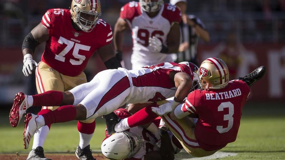 San Francisco 49ers starting quarterback C.J. Beathard (3) is sacked by Arizona Cardinals' Olsen Pierre (72) in the first quarter during a game at Levi's Stadium in Santa Clara on Sunday.