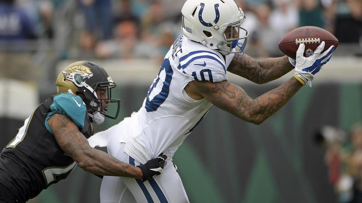 Indianapolis Colts wide receiver Donte Moncrief (10) catches a pass in front of Jacksonville Jaguars cornerback A.J. Bouye during the first half of an NFL football game, Sunday, Dec. 3, 2017, in Jacksonville, Fla.