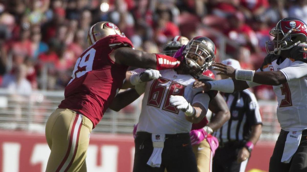 49ers defensive end DeForest Buckner, left, punches Bucs center Joe Hawley, and is assessed a penalty in the second quarter on Sunday, October 23, 2016 at Levi’s Stadium in Santa Clara, Calif.