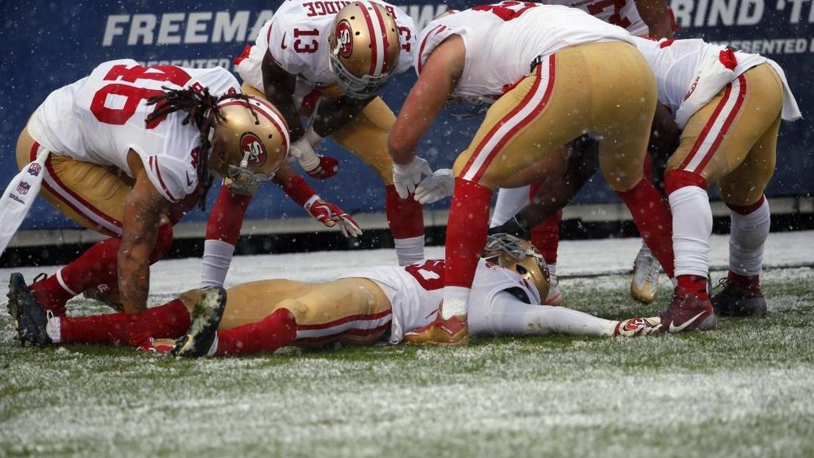 San Francisco cornerback Dontae Johnson makes a snow angel in the end zone after returning a blocked punt for what he thought was a touchdown. He was ruled out of bounds at the 4-yard line. Teammate Rashard Robinson also made a snow angel and was flagged for an unsportsmanlike conduct penalty.