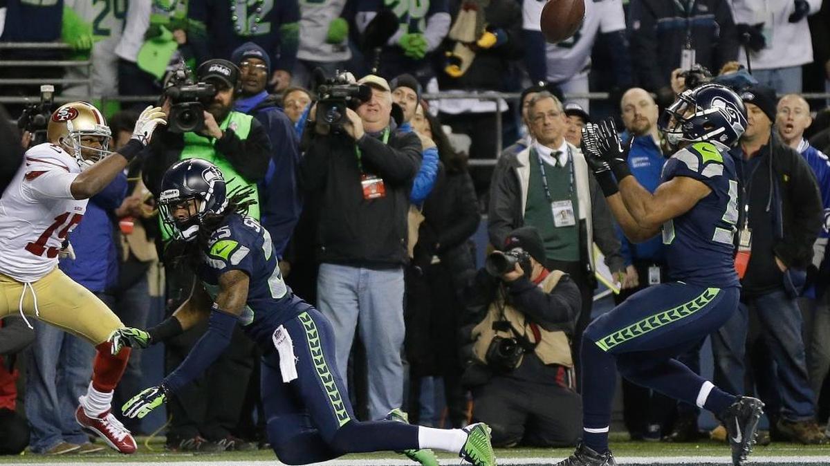 Seattle Seahawks' Malcolm Smith intercepts a pass in the final seconds of the second half of the NFL football NFC Championship game against the San Francisco 49ers, Sunday, Jan. 19, 2014, in Seattle. The Seahawks won 23-17 to advance to Super Bowl XLVIII.