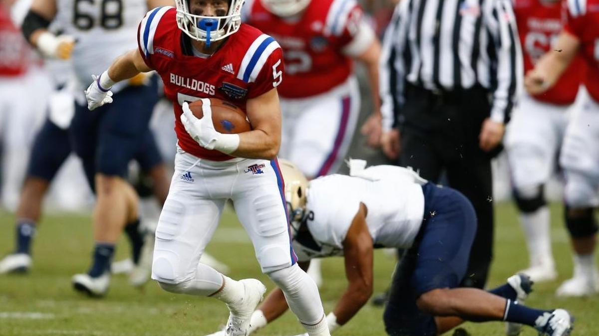 Louisiana Tech wide receiver Trent Taylor (5) runs for a touchdown after a catch against Navy during first half of the Armed Forces Bowl NCAA college football game, Friday, Dec. 23, 2016, in Fort Worth, Texas.