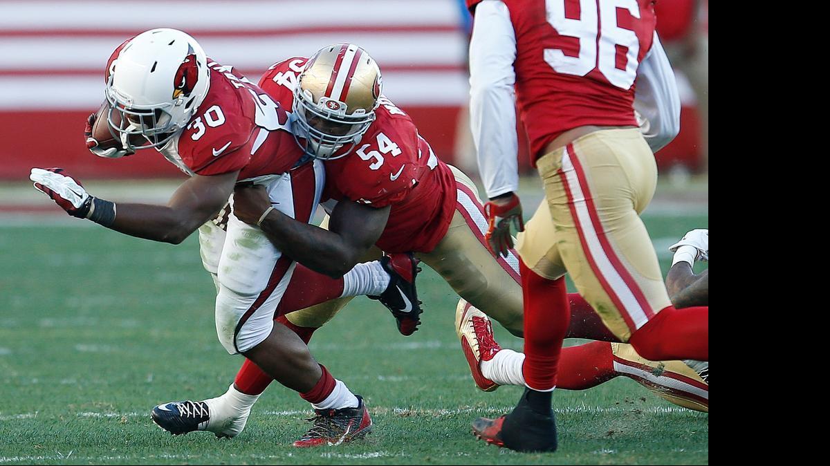 
Arizona Cardinals running back Stepfan Taylor (30) is tackled by San Francisco 49ers outside linebacker Nick Moody (54) during the third quarter of an NFL game in Santa Clara in December. “A guy that’s really moving around and feeling the defense the right way is Nick Moody,” coach Jim Tomsula said.
