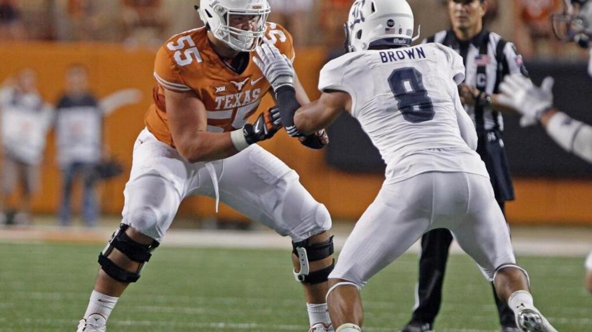 Texas lineman Connor Williams (55) looks to block Rice defender Derek Brown (8) during the second half of an NCAA college football game, Saturday, Sept. 12, 2015, in Austin, Texas.