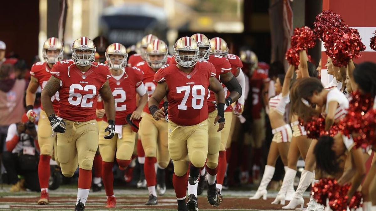 
San Francisco 49ers offensive guard Ian Silberman (62) and guard Joe Looney (78) run onto the field with teammates before an NFL preseason football game against the San Diego Chargers in Santa Clara, Calif., Thursday, Sept. 3, 2015.
