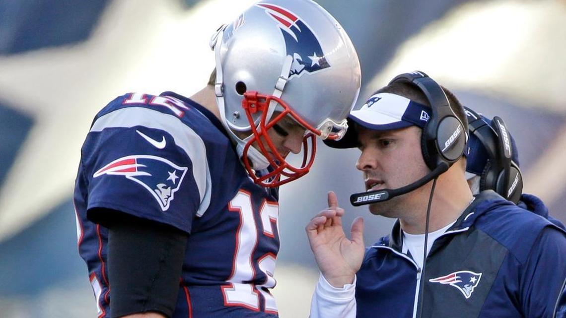 FILE - In this Dec. 4, 2016, file photo, New England Patriots quarterback Tom Brady (12) confers with offensive coordinator Josh McDaniels during the first half of an NFL football game against the Los Angeles Rams, in Foxborough, Mass.