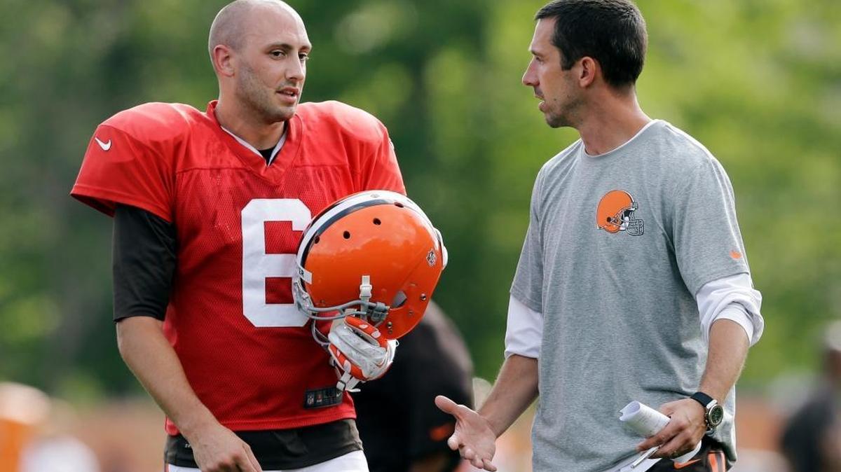 Cleveland Browns quarterback Brian Hoyer, left, talks with offensive coordinator Kyle Shanahan during a training camp practice on Aug. 6, 2014, in Berea, Ohio.