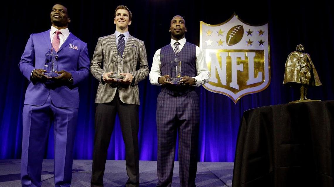 San Francisco 49ers receiver Anquan Boldin, right, is among the finalists for the Walter Payton NFL Man of the Year Award at a news conference Friday, Feb. 5, 2016, in San Francisco. Other nominees are New York Giants quarterback Eli Manning, center, and New Orleans Saints tight end Benjamin Watson.
