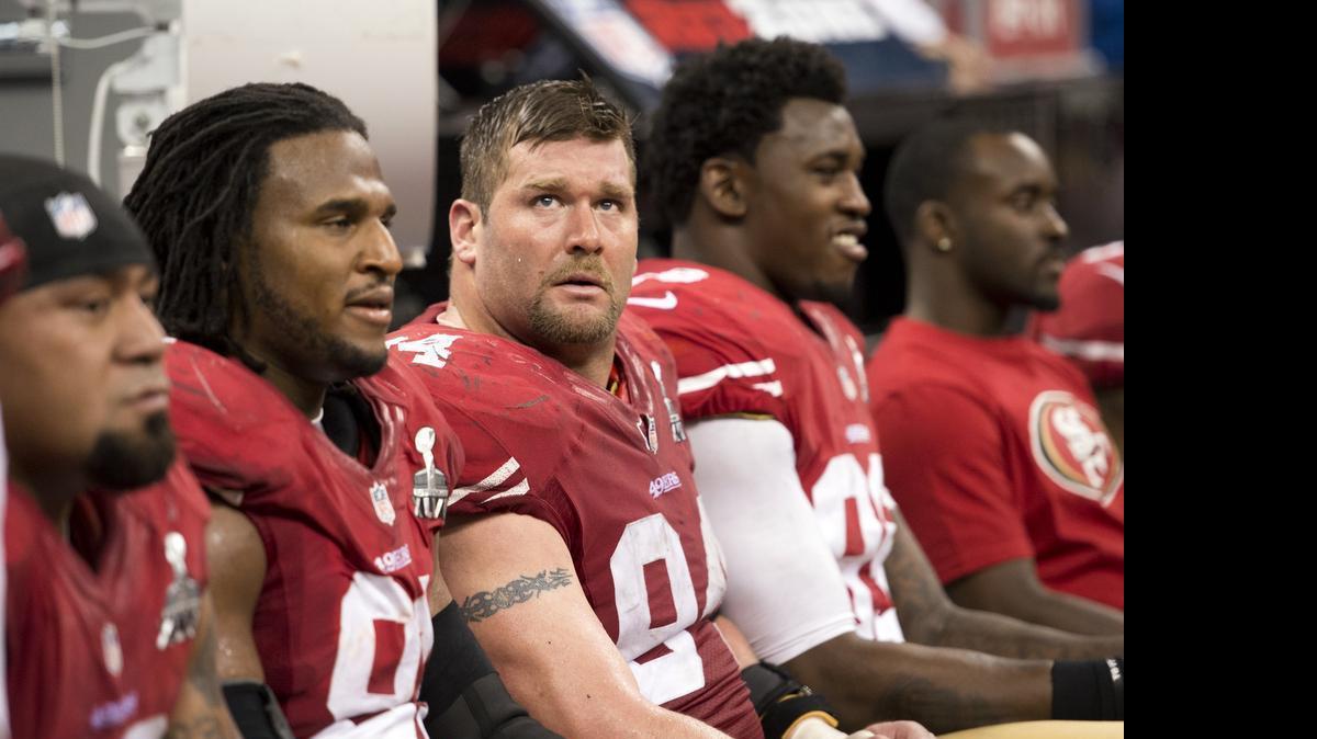 
San Francisco defensive end Justin Smith (94) and outside linebacker Aldon Smith (99) watch the time wind down as the 49ers trail the Baltimore Ravens during Super Bowl XLVII in 2013 at the Superdome in New Orleans.
