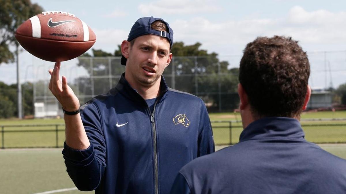 Cal Bears quarterback Davis Webb spins a ball on his had as he speaks to a team official after during a walk through a training session at a field in Sydney Thursday, Aug. 25, 2016. Cal will play Hawaii in their first college football game of the 2016 season at the College Football Sydney Cup on Saturday, Aug 27.
