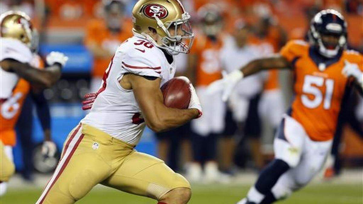 San Francisco 49ers Jarryd Hayne (38), of Australia, returns a kickoff during the second half of an NFL preseason football game against the Denver Broncos, Saturday, Aug. 29, 2015, in Denver.