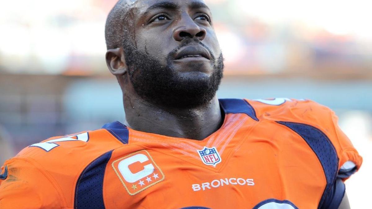 Denver Broncos defensive end Elvis Dumervil looks on against the Tampa Bay Buccaneers during an NFL football game, Sunday, Dec. 2, 2012, in Denver.
