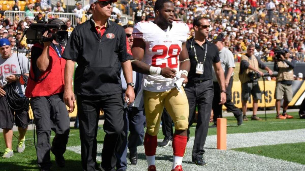 San Francisco 49ers running back Carlos Hyde (28) leaves the field after being injured in the third quarter of an NFL football game against the Pittsburgh Steelers, Sunday, Sept. 20, 2015, in Pittsburgh.