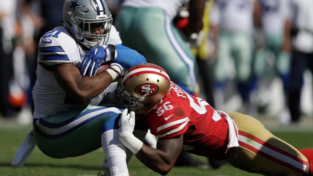 Dallas Cowboys running back Ezekiel Elliott (21) is tackled by San Francisco 49ers linebacker Reuben Foster (56) during the first half of an NFL football game in Santa Clara, Calif., Sunday, Oct. 22, 2017.