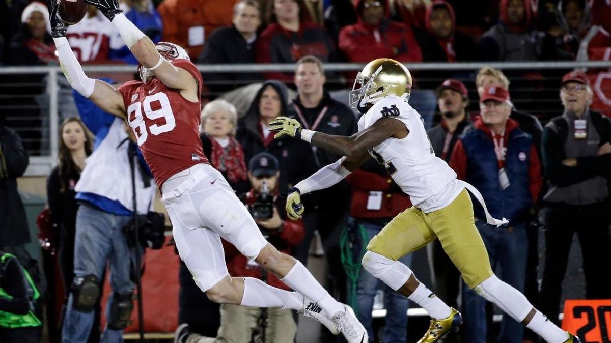 Stanford wide receiver Devon Cajuste (89) makes a catch in front of Notre Dame safety Elijah Shumate (22) during the second half of an NCAA college football game Saturday, Nov. 28, 2015, in Stanford, Calif. Stanford won 38-36.