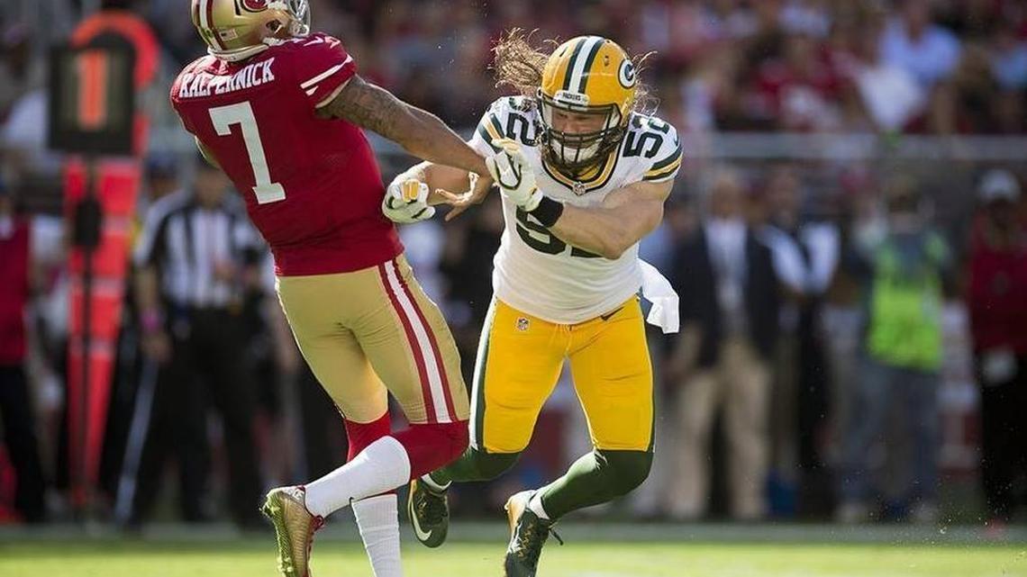 The 49ers’ Colin Kaepernick absorbs a hit by Packers linebacker Clay Matthews in a Week 4 game in October.