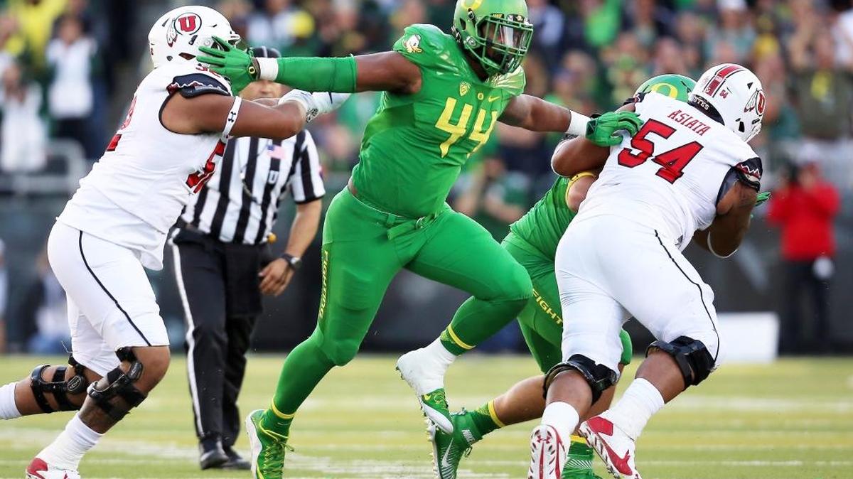 In this Sept. 26, 2015, file photo, Oregon defensive lineman DeForest Buckner (44) breaks through the Utah offensive line during the first half of an NCAA college football game, in Eugene, Ore. Buckner was named to the PAC-12 All-Conference team Thursday, Dec. 17, 2015.