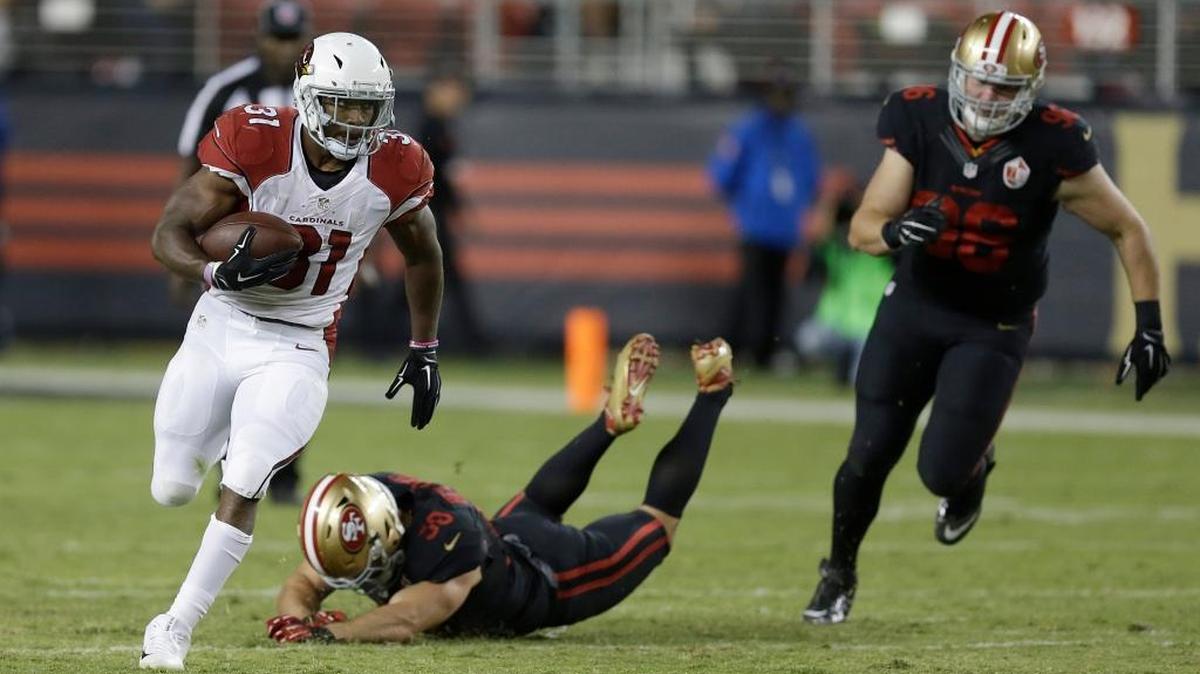 Arizona Cardinals running back David Johnson (31) runs from San Francisco 49ers linebacker Nick Bellore, bottom, and defensive end Taylor Hart (96) during the second half of an NFL football game in Santa Clara, Calif., Thursday, Oct. 6, 2016.