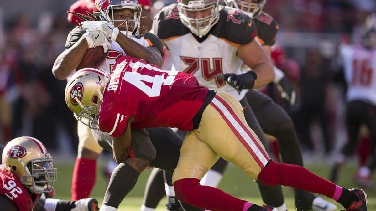 San Francisco’s Antoine Bethea (41) tackles Tampa Bay running back Jacquizz Rodgers in the third quarter at Levi’s Stadium on Sunday, October 23, 2016 in Santa Clara, Calif.