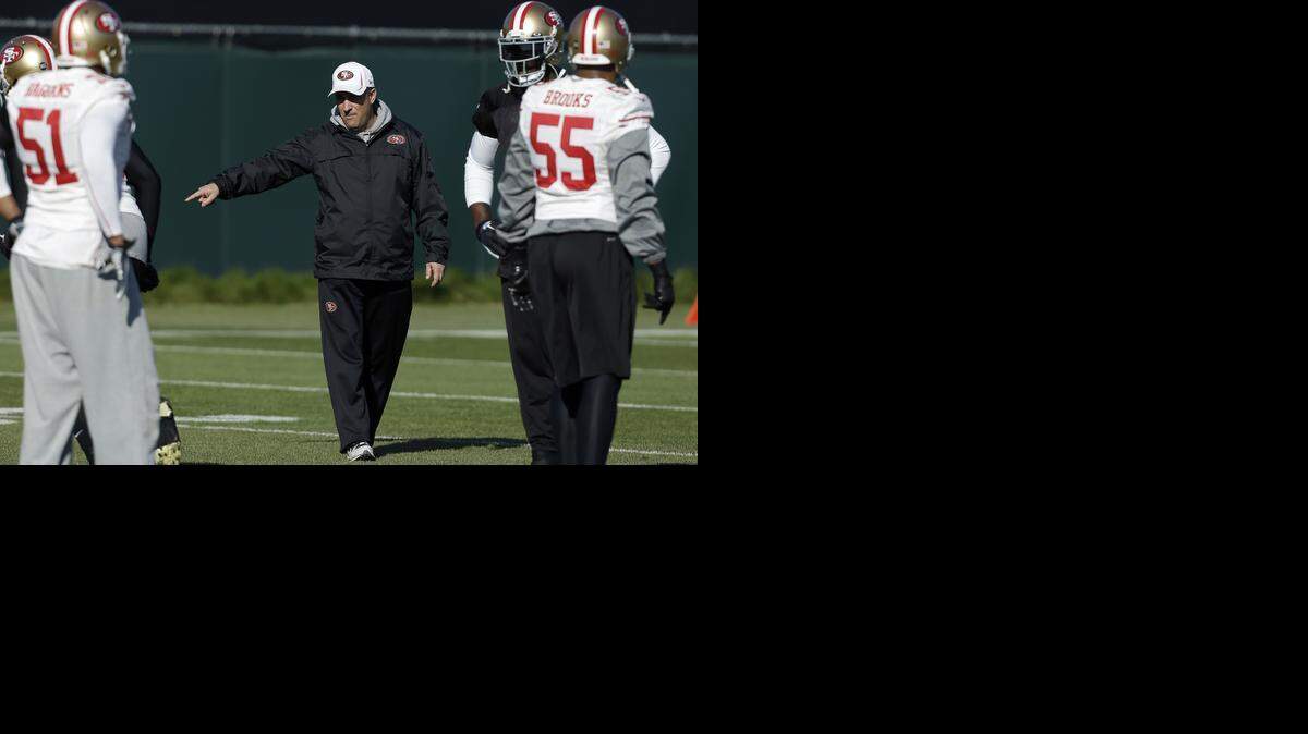
Linebacker NaVorro Bowman, for one, wants to see defensive coordinator Vic Fangio, center, return.


