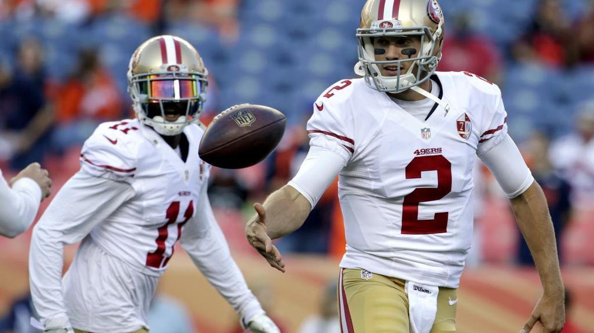 49ers quarterback Blaine Gabbert tosses the football to a teammate during warmups before a preseason NFL football game against the Denver Broncos, Saturday, Aug. 20, 2016, in Denver.