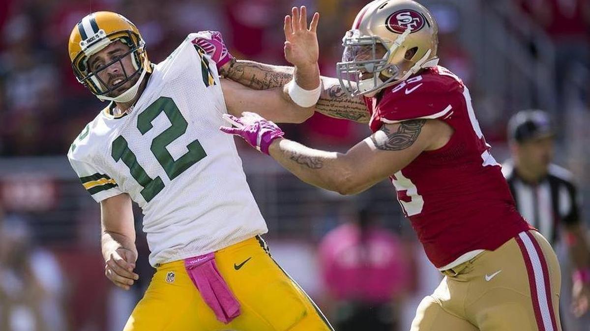 Aaron Lynch puts a hit on Aaron Rodgers in a game in Santa Clara.