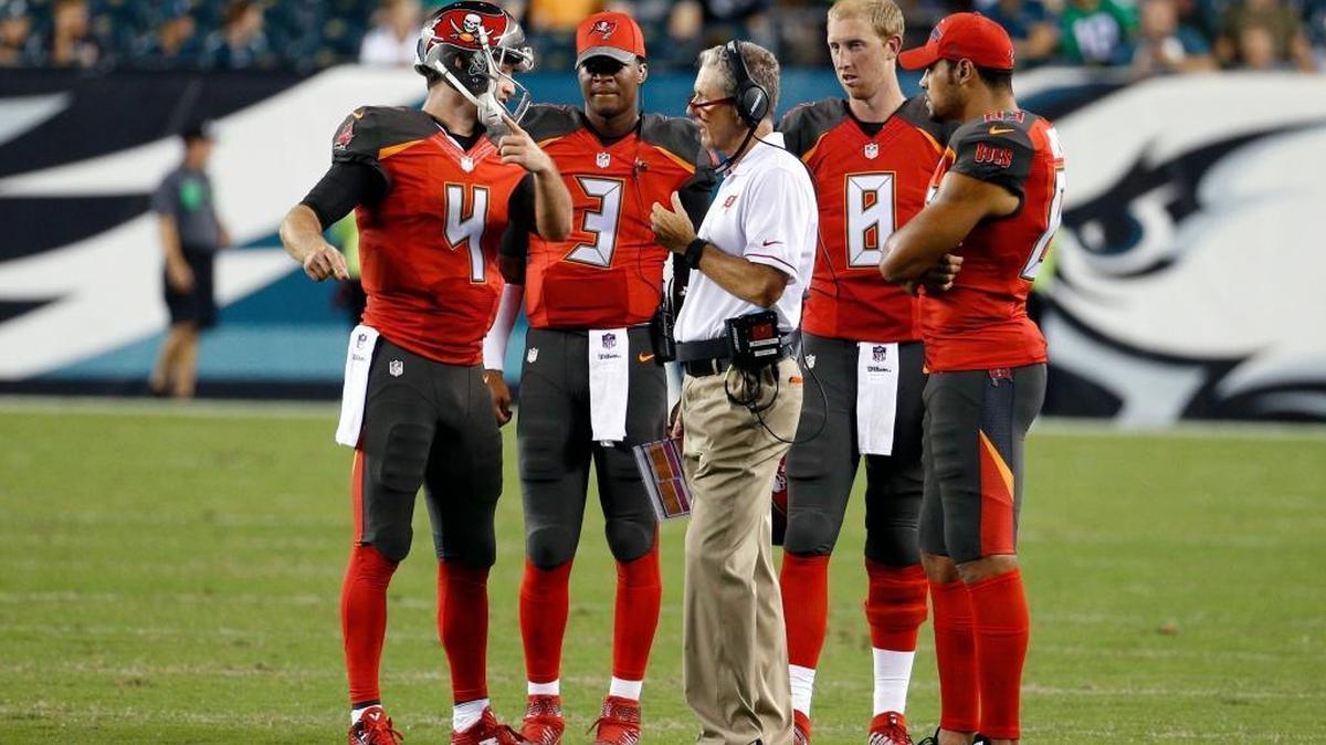 Tampa Bay Buccaneers coach Dirk Koetter stands on the field with quarterbacks Ryan Griffin (4, Jameis Winston (3) and Mike Glennon (8) and wide receiver Vincent Jackson (83) during the second half of a preseason NFL football game against the Philadelphia Eagles on Thursday, Aug. 11, 2016, in Philadelphia.