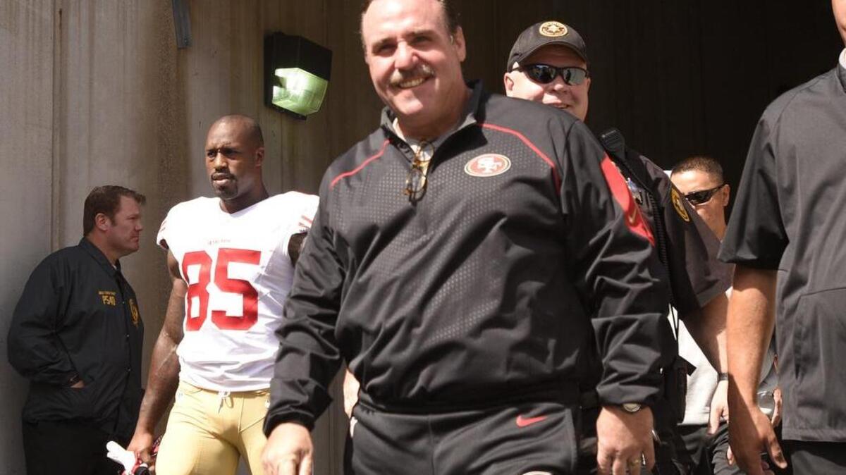 
San Francisco 49ers head coach Jim Tomsula takes the field before an NFL football game against the Pittsburgh Steelers, Sunday, Sept. 20, 2015, in Pittsburgh.
