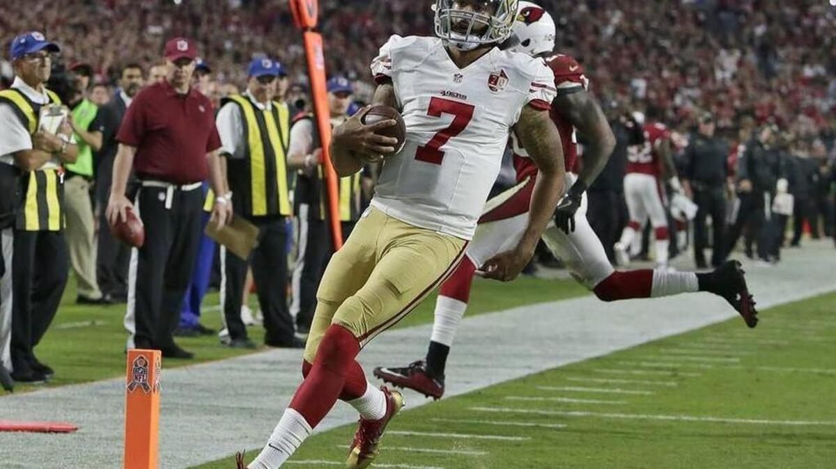San Francisco 49ers quarterback Colin Kaepernick (7) runs for a touchdown as Arizona Cardinals outside linebacker Deone Bucannon (20) defends during the second half of an NFL football game Sunday, Nov. 13, 2016, in Glendale, Ariz.