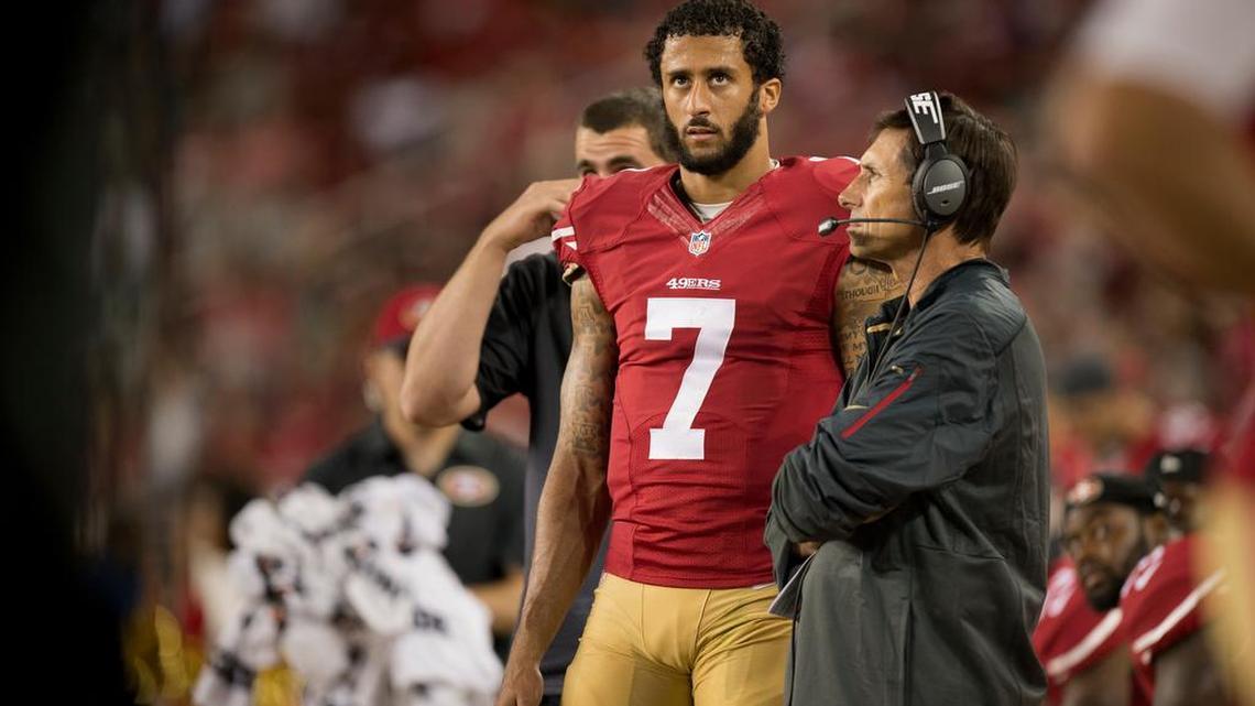 Colin Kaepernick and quarterbacks coach Steve Logan watch during the fourth quarter of Thursday’s loss to Seattle. Coach Jim Tomsula said Kaepernick remains the starter.